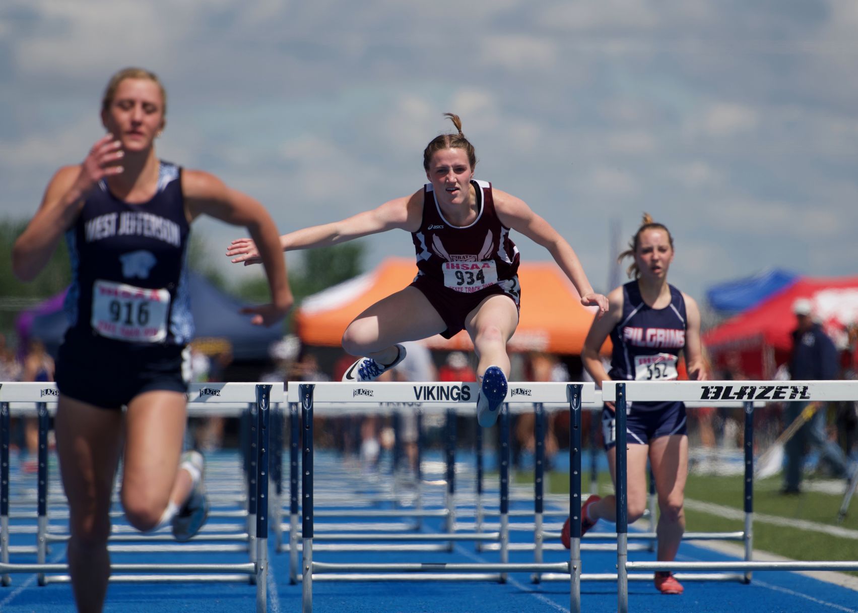 WS boys take second Ellie Stegelmeire clearing the last hurdle.jpeg